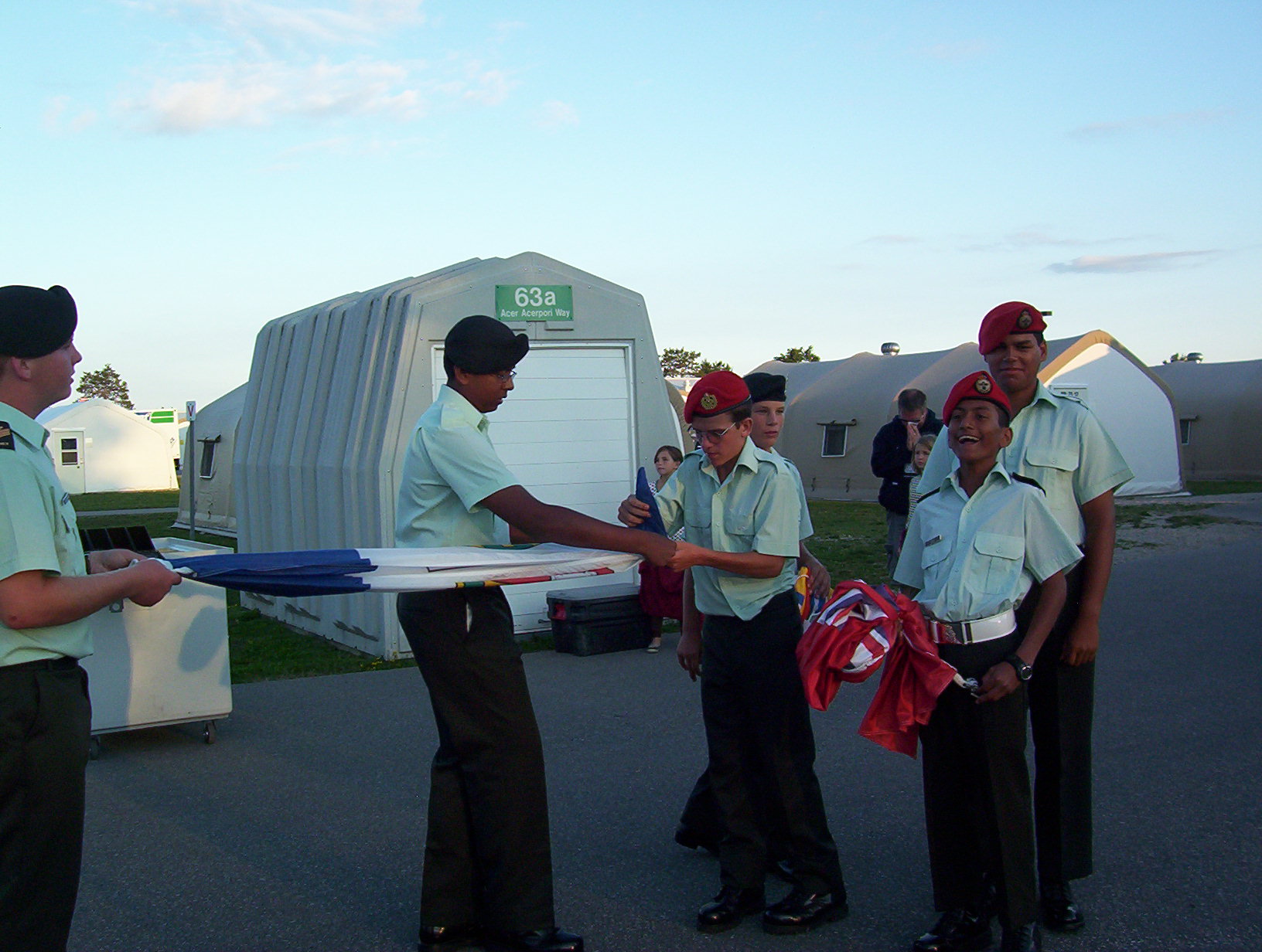 standing with friends, guilty smile, preparing flags