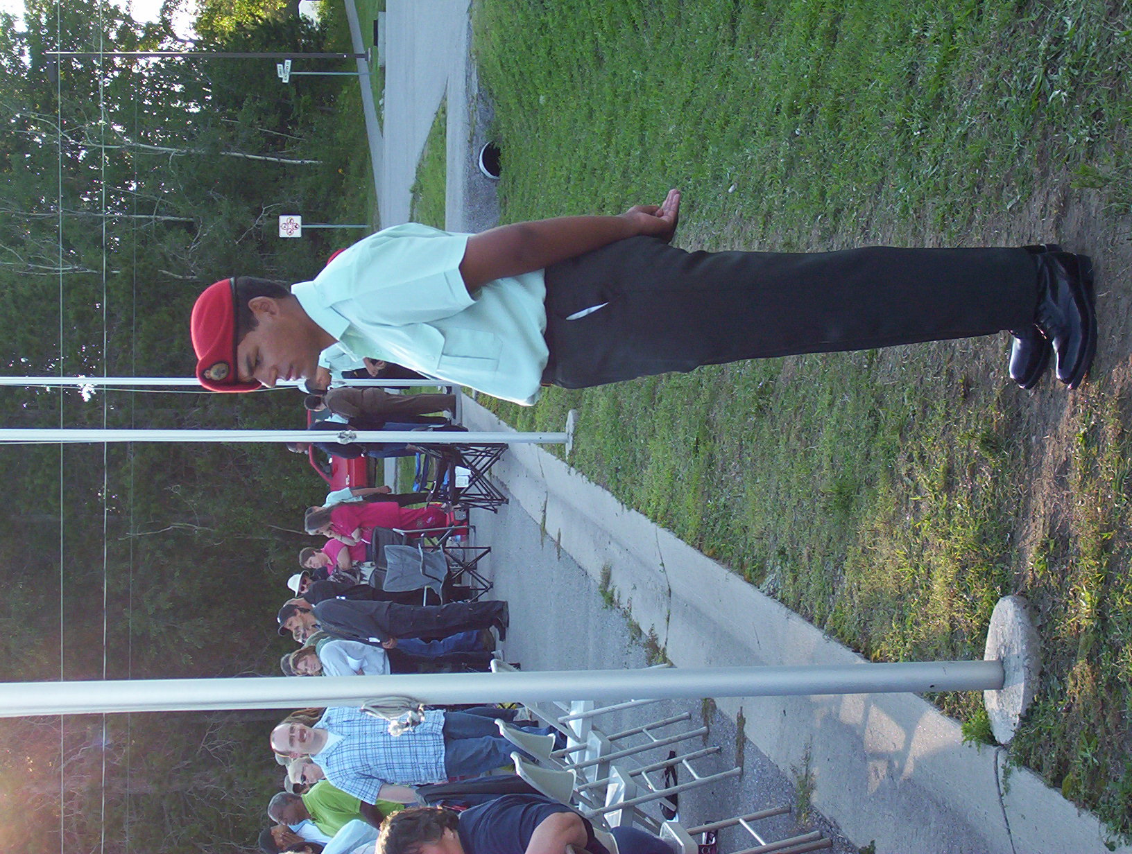 standing by the flagpole — photo 1